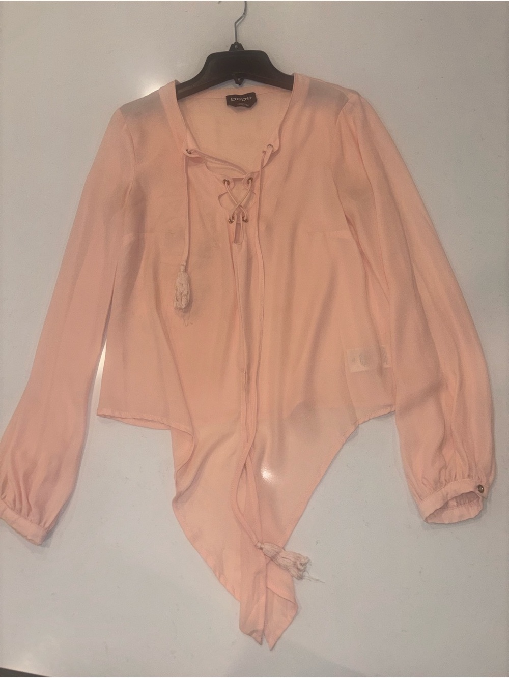 bebe Peach Lace-Up Handkerchief Hem Blouse
